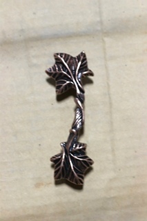 NEW SET OF CABINET HANDLES MAPLE LEAF BRONZE PRICE:10 FOR $10.00  